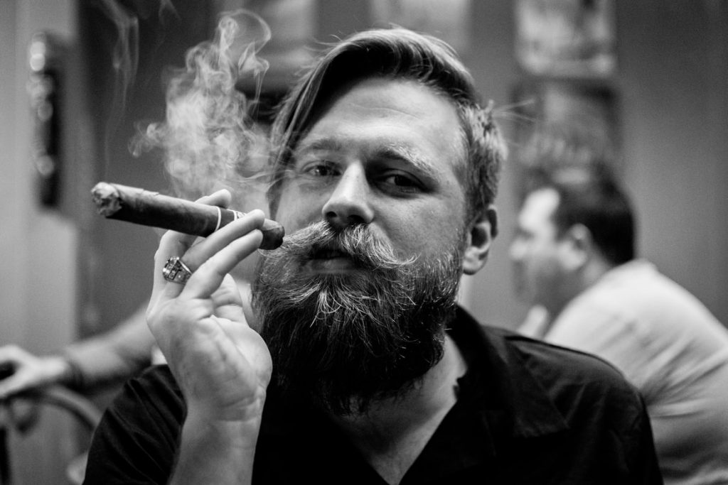 A man enjoying his cigar. 