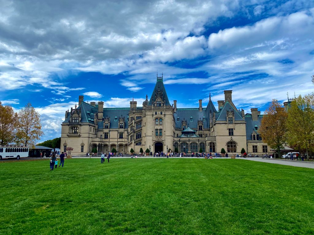 People walking on the grass at the Biltmore estate, outside Asheville, 