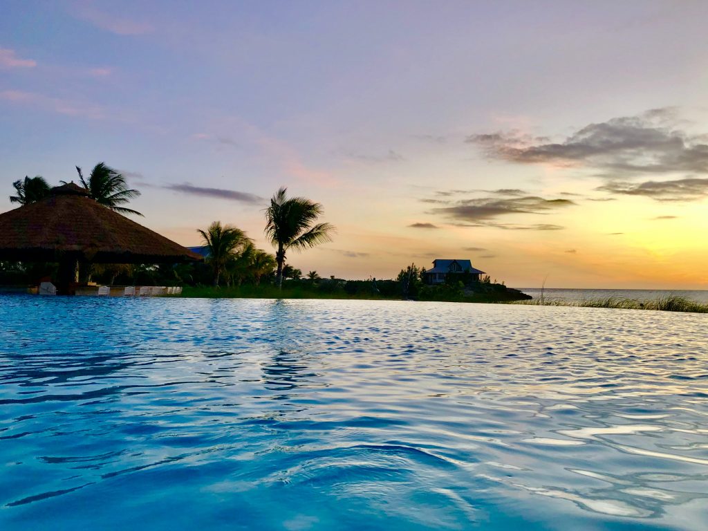 Private Island getaways offer a unique and serene holiday. Pictured: Pool at sunset on an island in the Bahamas. 