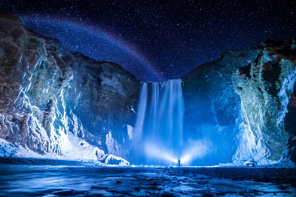 A waterfall at night in Iceland's remote wilderness. 