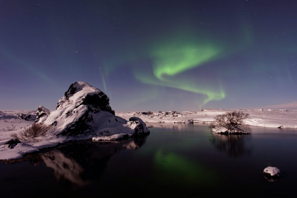 The northern lights over Iceland's mountains.