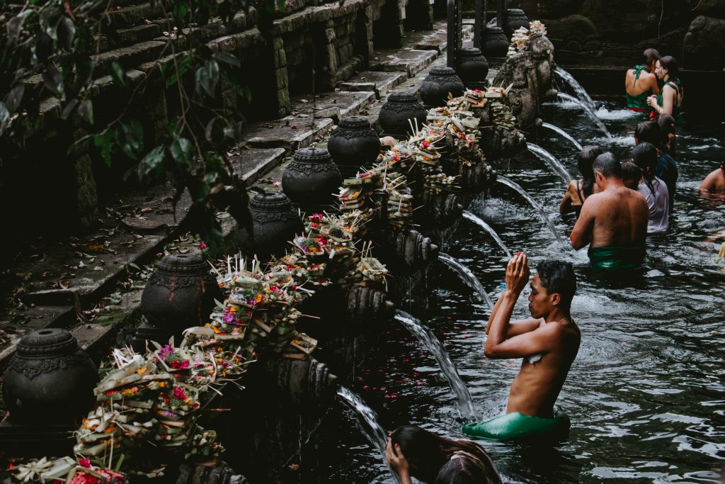 Men washing at a temple in Bali. 